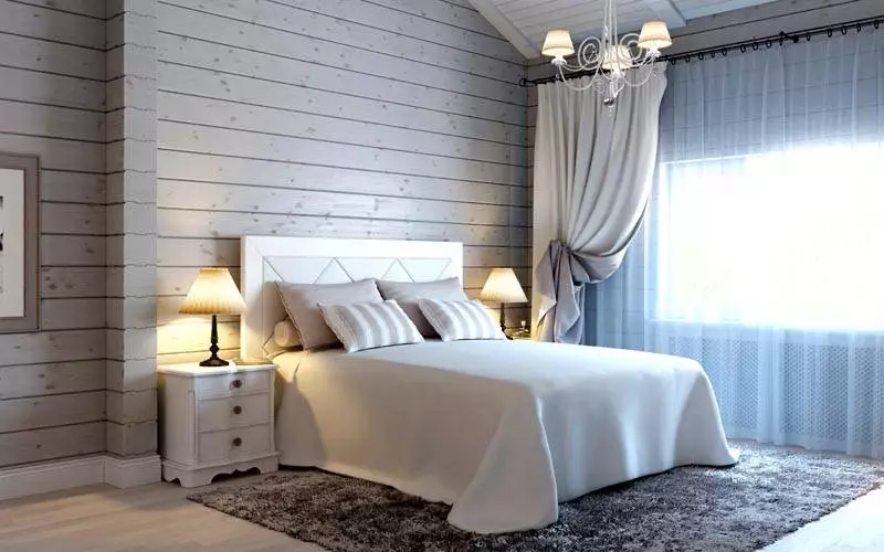 На фото спальня в деревянном доме в светлой цветовой гамме